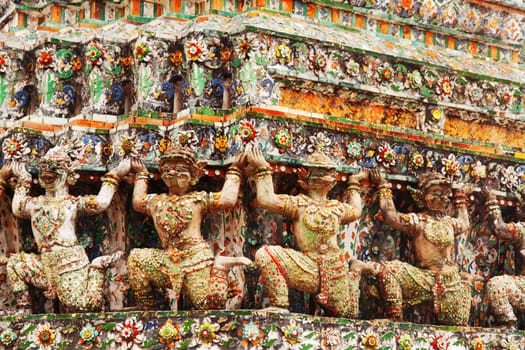 Wat Arun Rajwararam or Temple of the Dawn is a Buddhist temple (wat) in the Bangkok Yai district of Bangkok, Thailand, on the Thonburi west bank of the Chao Phraya River. The full name of the temple is Wat Arunratchawararam Ratchaworamahawihan. Named after Aruna, the Indian God of Dawn, the Wat Arun is considered one of the most well known landmark of Thailand. The prangs are decorated by seashells and bits of porcelain which had previously been used as ballast by boats coming to Bangkok from China.