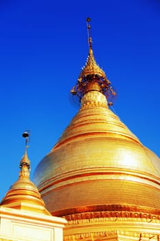 The Maha Lawka Marazein Pagoda at the center of the Kuthodaw Pagoda. Kuthodaw Pagoda is a Buddhist stupa, located in Mandalay, Burma (Myanmar), that contains the world's largest book. It lies at the foot of Mandalay Hill. In the grounds of the pagoda are 729 stone-inscription caves, each containing a marble slab inscribed on both sides with a page of text from the Tipitaka, the entire Pali Canon of Theravada Buddhism. Pagoda Kuthodaw stretching from 1860 to 1868 during the reign of King Mindona.