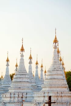Kuthodaw Pagoda is a Buddhist stupa, located in Mandalay, Burma (Myanmar), that contains the world's largest book. It lies at the foot of Mandalay Hill. In the grounds of the pagoda are 729 stone-inscription caves, each containing a marble slab inscribed on both sides with a page of text from the Tipitaka, the entire Pali Canon of Theravada Buddhism. Pagoda Kuthodaw stretching from 1860 to 1868 during the reign of King Mindona.
