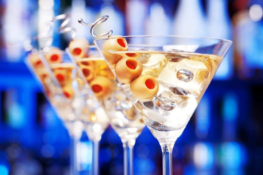 Several glasses of famous cocktail Martini, shot at a bar with shallow depth of field....Ingredients