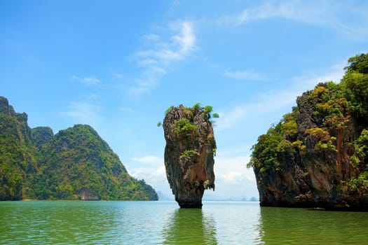 Khao Phing Kan is a pair of islands on the west coast of Thailand, in the Phang Nga Bay, Andaman Sea, near Phuket. About 40 metres from its shores lies a 20 meters tall islet Ko Tapu or Khao Tapu. The island is a part of the Ao Phang Nga National Park. Since 1974, when it was featured in the James Bond movie The Man with the Golden Gun, it is popularly called James Bond Island.