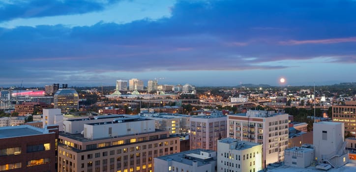 Moonrise over Portland Oregon Horizon Cityscape during Evening Blue Hour Panorama