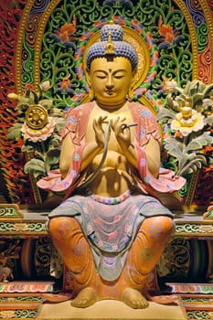 Wood Carved Colorful Sitting Buddha Statue with Intricate Colorful Background