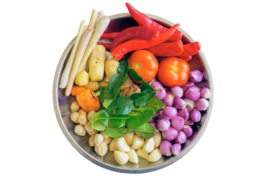 Fresh Ingredients for Cooking Southeast Asian Curry Dish Sauce with Chili Peppers Turmeric Ginger Lemon Grass Onions Shallots Lime Leaves Garlic Candlenut Tomato