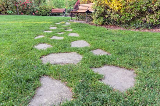 Natural Stone Steps on Green Grass Lawn to Park Bench Low Perspective