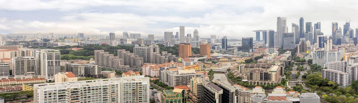 Condominiums Along Singapore River with Central Business District Skyline Panorama