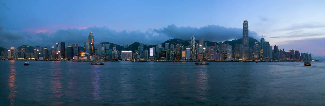 Hong Kong Island Central City Skyline Along Victoria Harbor Sunset Blue Hour Panorama