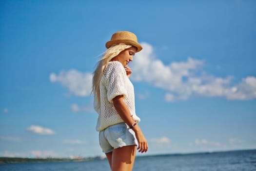 Young female having summer rest by the sea