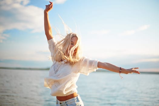 Delighted blond girl enjoying summer rest