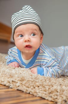 Portrait of a 2 months old baby boy at his home.