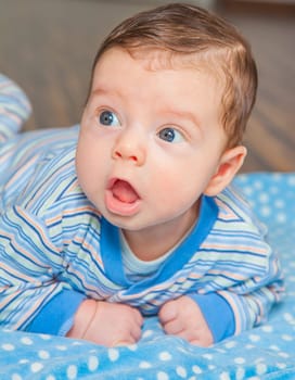 Portrait of a 2 months old baby boy at his home.