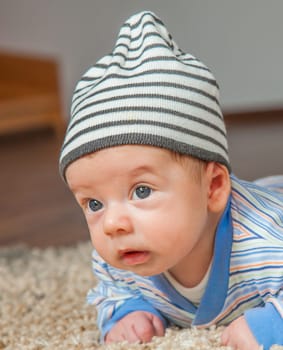 Portrait of a 2 months old baby boy at his home.