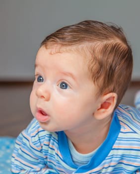Portrait of a 2 months old baby boy at his home.