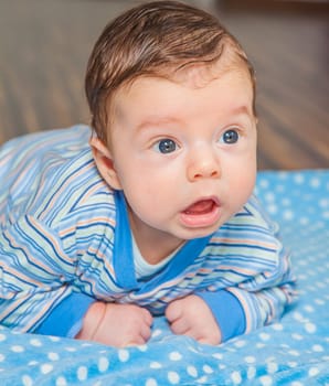 Portrait of a 2 months old baby boy at his home.
