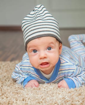 Portrait of a 2 months old baby boy at his home.