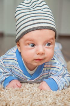 Portrait of a 2 months old baby boy at his home.