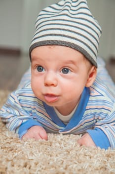 Portrait of a 2 months old baby boy at his home.