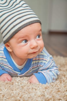 Portrait of a 2 months old baby boy at his home.