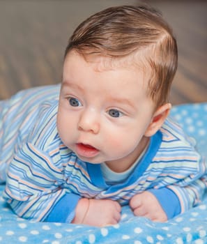 Portrait of a 2 months old baby boy at his home.