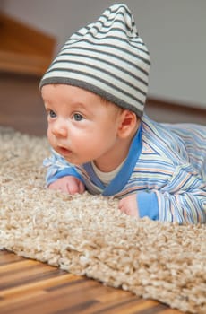 Portrait of a 2 months old baby boy at his home.