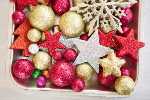 Colorful Christmas balls and stars as a festive backdrop for Christmas