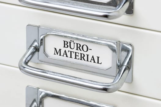 Drawer cabinet with the inscription office material