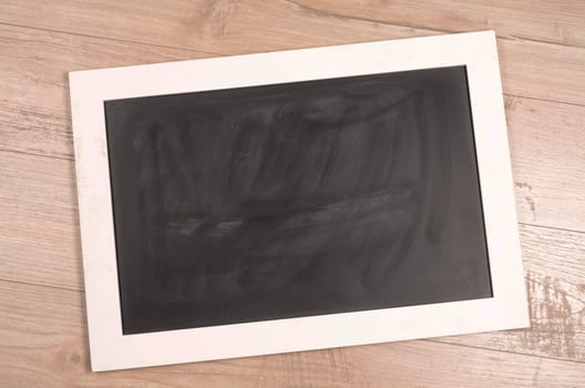 Chalkboard on a rustic wooden background
