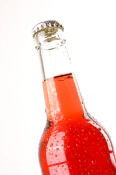 Cold bottle of elder juice on a white background