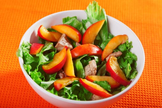 Chicken salad with peaches and green salad