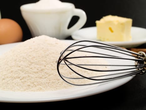 Preparing a Cake with flour, eggs, and milk