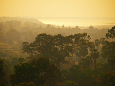 View of West Baray at Angkor Wat from Phnom Bakheng Temple at sunset. The baray is an artificial body of water measuring 8 b 2 kilometers.