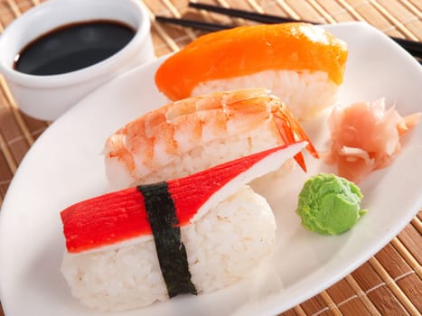 Three types of nigiri sushi - with salmon, shrimp and surimi