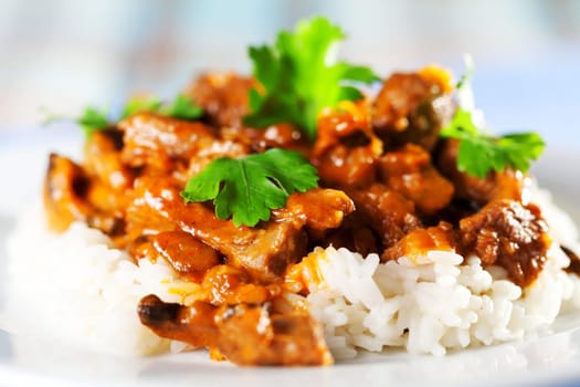 Pork curry with rice and cilantro
