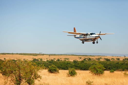 Small plain in Masai Mara, Kenya, just about to land
