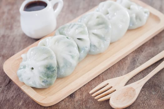 Chinese leek steamed dessert on wooden table, stock photo