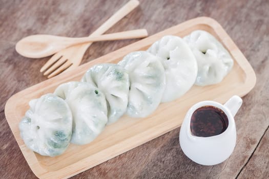 Chinese leek steamed dessert on wooden table, stock photo