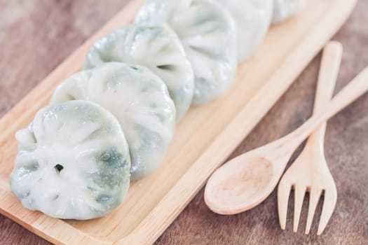 Chinese leek steamed dessert on wooden table, stock photo