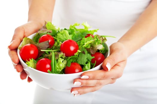 Salad bowl in woman hands isolated on white background