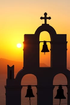 Famous church in Fira, Santorini at sunset
