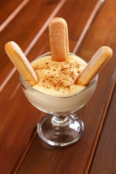 Homemade vanilla cream with biscotti and cinnamon