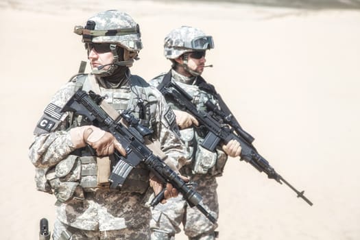 United States paratroopers airborne infantrymen in action in the desert
