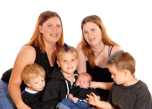 Two women with there three boy's and a three weeks old baby in a .closeup picture, isolated for white background..