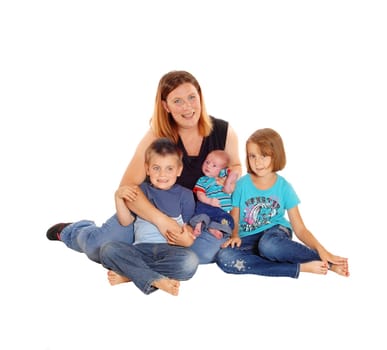 A mother with her boy and girl sitting on the floor holding her newborn.baby in her arms, isolated for white background..