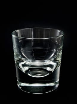 Empty Tequila Glass isolated on black