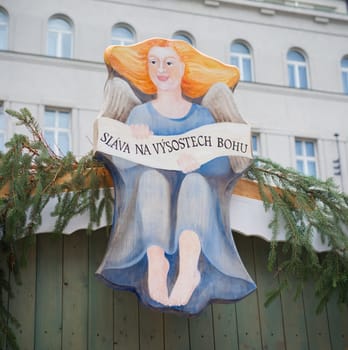 plate of an christmas angel with a czech saying on it meaning Glory in the highest God