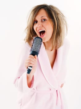 Woman singing with hairbrush
