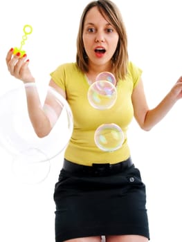 Girl blowing bubbles, isolated on white