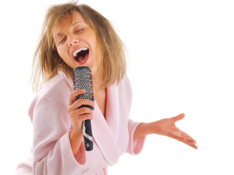 Woman singing with hairbrush