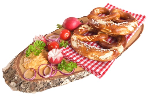 Bavarian vegetarian breakfast with two pretzels and obazda on a white background
