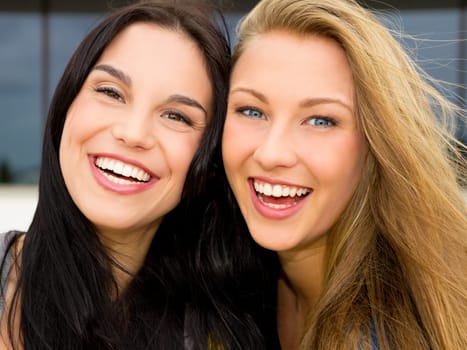 Portrait of a beautiful two young girls smiling